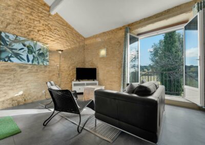 Living room with television and terrace